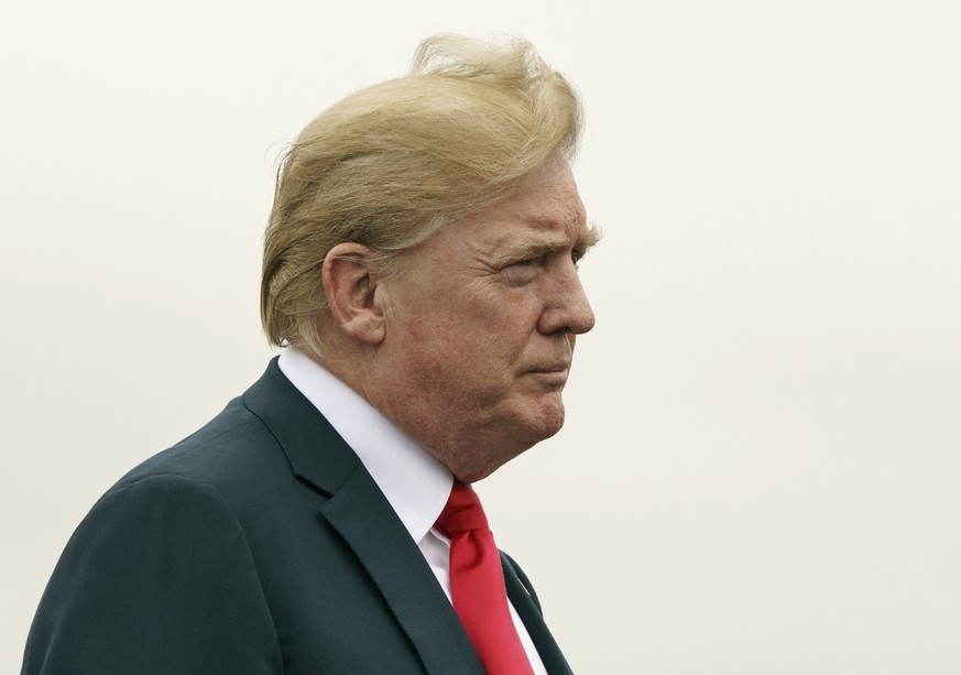 President Donald Trump boards Air Force One at Morristown Municipal Airport, in Morristown, N.J., Sunday, July 22, 2018, en route to Washington after staying at Trump National Golf Club in Bedminster, ...