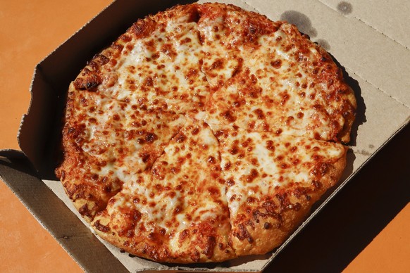 This is a small Domino&#039;s pizza made in a Domino&#039;s Pizza shop in downtown Pittsburgh Monday, July 15, 2019. (AP Photo/Gene J. Puskar)