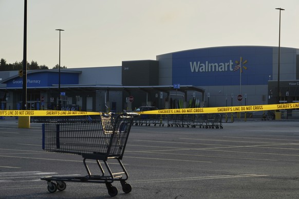 A shopping cart anchors police tape outside a Walmart where multiple people were stabbed in a violent attack Saturday, July 26, 2025, in Traverse City, Mich. (AP Photo/Ryan Sun)
US Michigan Walmart St ...