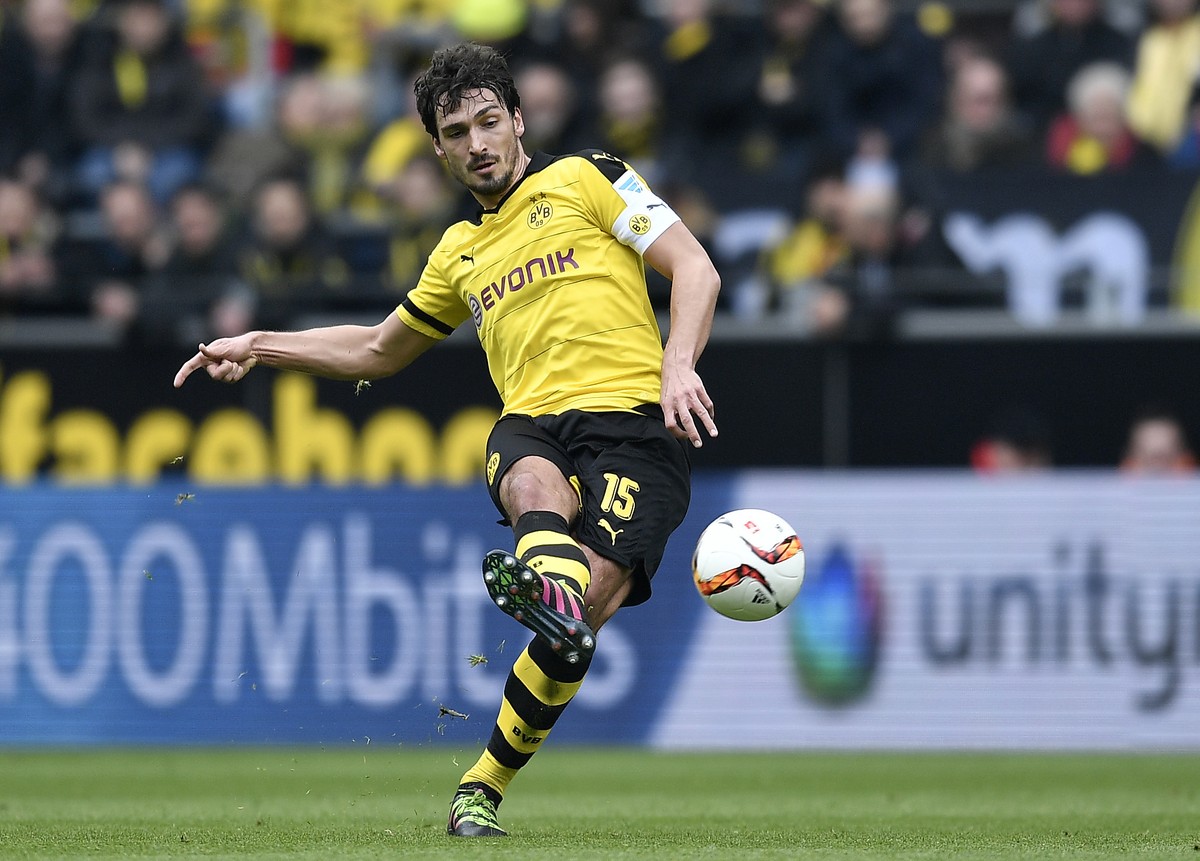 FILE - In this April 30, 2016 file photo Dortmund's Mats Hummels kicks the ball during the German Bundesliga soccer match between Borussia Dortmund and VfL Wolfsburg in Dortmund, Germany. Borussi ...