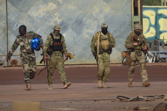 FILE - This undated file photograph issued by French military shows three Russian mercenaries, right, in northern Mali. Russia has engaged in under-the-radar military operations in at least half a doz ...