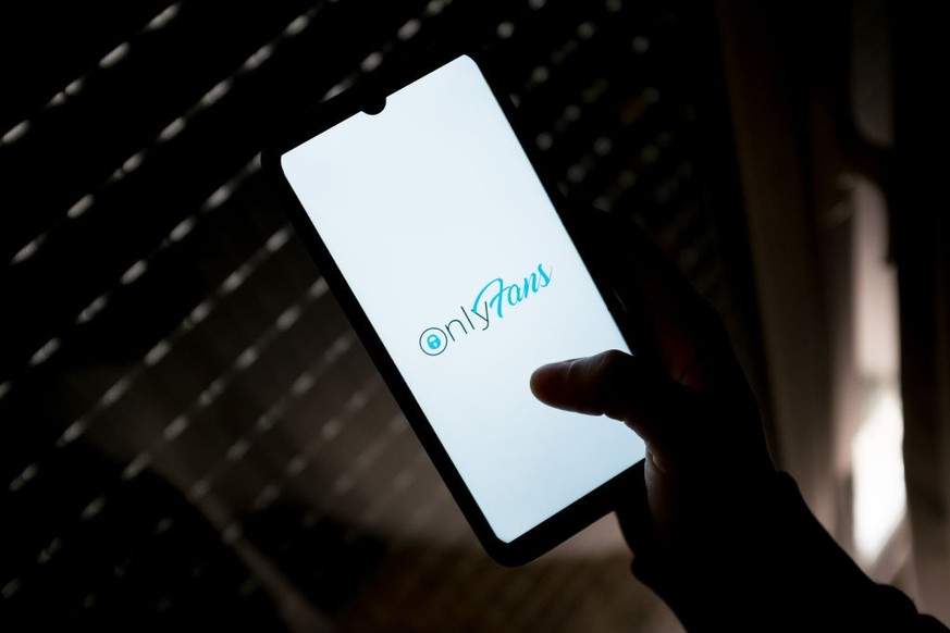 In this photo illustration an OnlyFans logo seen displayed on a smartphone screen in Athens, Greece on March 18, 2022. (Photo by Nikolas Kokovlis/NurPhoto via Getty Images)