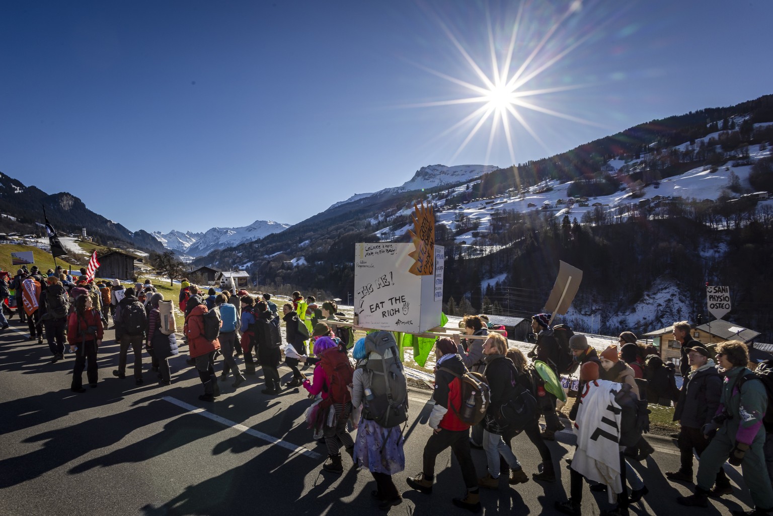 Protestors hike during a demonstration of the collective &#039;Strike WEF&#039; before the annual meeting of the World Economic Forum, WEF, in Saas im Praettigau, Switzerland, on Saturday, January 18, ...