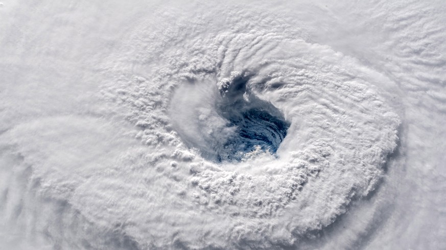 epa07015144 A handout photo made available by the NASA on 12 September 2018 shows the eye of category 4 hurricane Florence over the Atlantic, 12 September 2018. Hurricane Florence is a category 4 stor ...