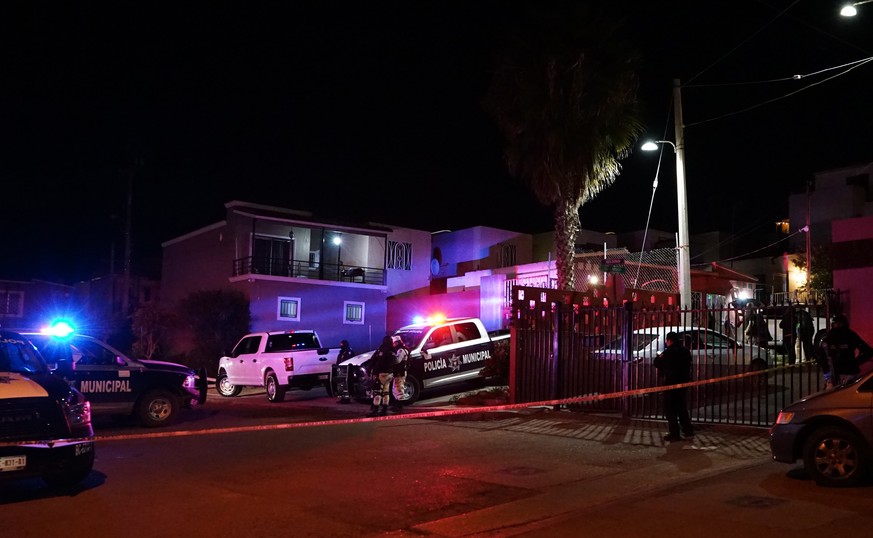 epa09705741 State police guard the house of journalist Lourdes Maldonado, at Santa Fe subdivision in Tijuana, state of Baja California, Mexico, 23 January 2022. Maldonado became the second Mexican jou ...