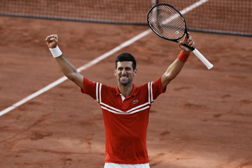 Serbia&#039;s Novak Djokovic celebrates as he defeats Stefanos Tsitsipas of Greece during their final match of the French Open tennis tournament at the Roland Garros stadium Sunday, June 13, 2021 in P ...