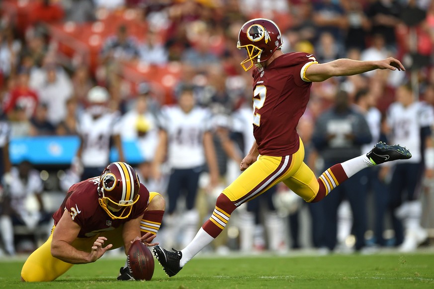 LANDOVER, MD - AUGUST 07: Kicker Kai Forbath #2 of the Washington Redskins kicks a field goal against the New England Patriots in the first quarter during a preseason NFL game at FedExField on August  ...