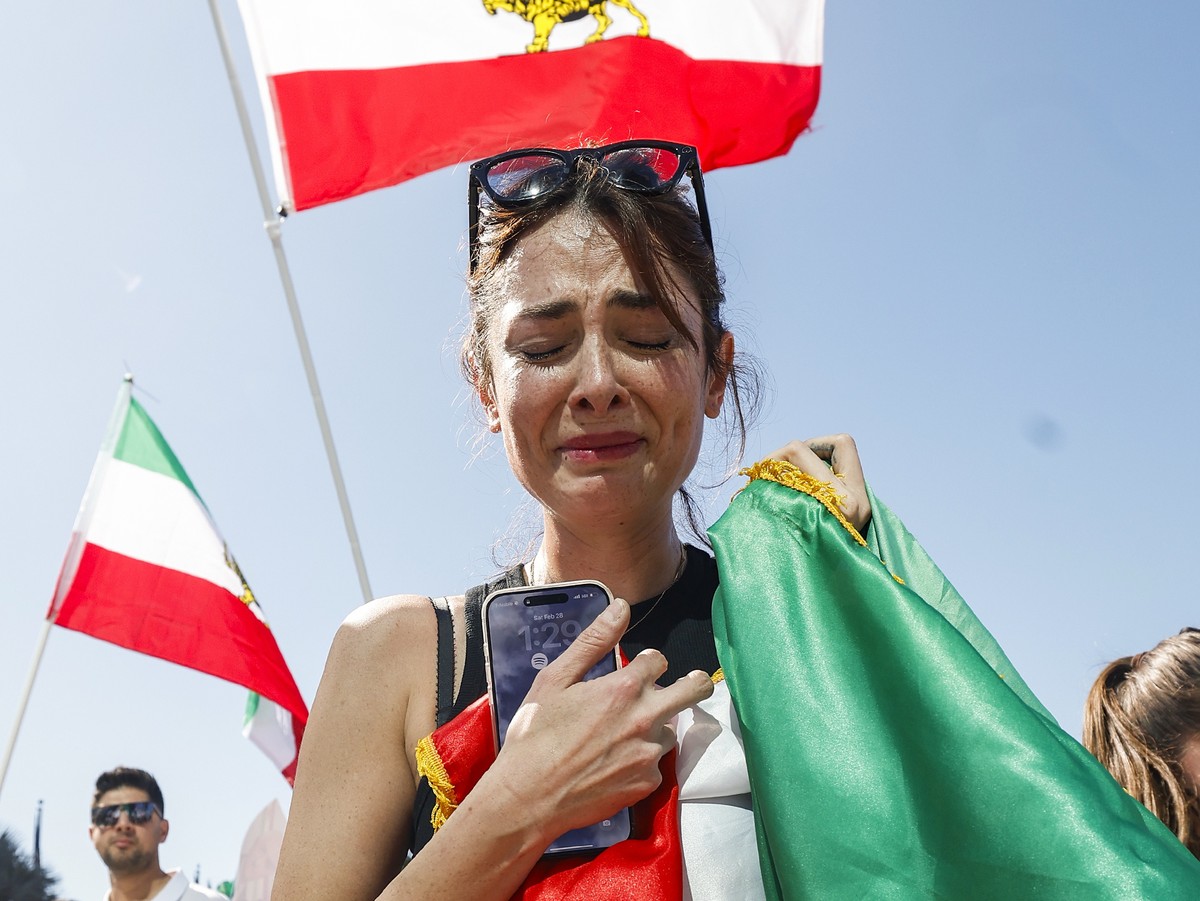 epa12786084 Iranian-American Paniz Rahnama becomes emotional while celebrating following the US and Israeli strikes in Iran; in Los Angeles, California, USA, 28 February 2026. According to a statement ...