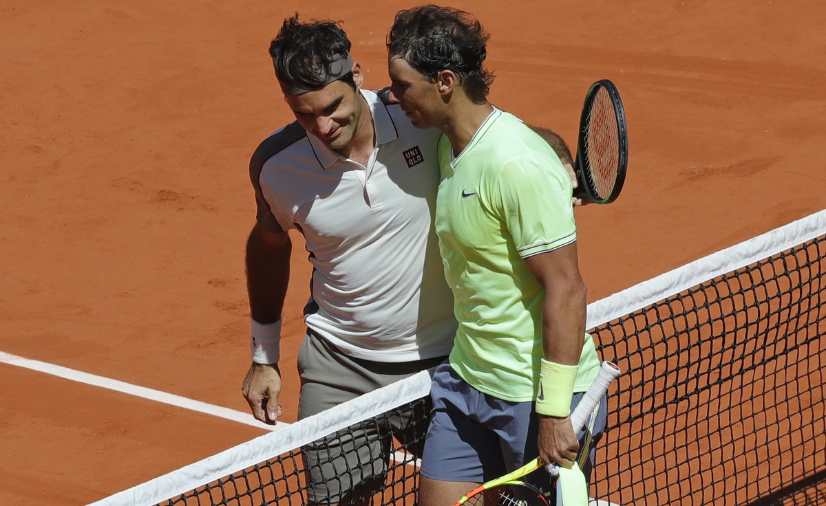 Spain's Rafael Nadal, right, is congratulated by Switzerland's Roger Federer after winning their semifinal match of the French Open tennis tournament at the Roland Garros stadium in Paris, F ...