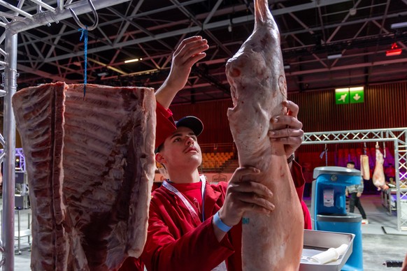 epa11998950 Staff members prepare pieces of meat during the 2025 World Butchers' Challenge (WBC) at Paris Exhibition Center in Paris, France, 30 March 2025. The butchery competition runs from 30  ...