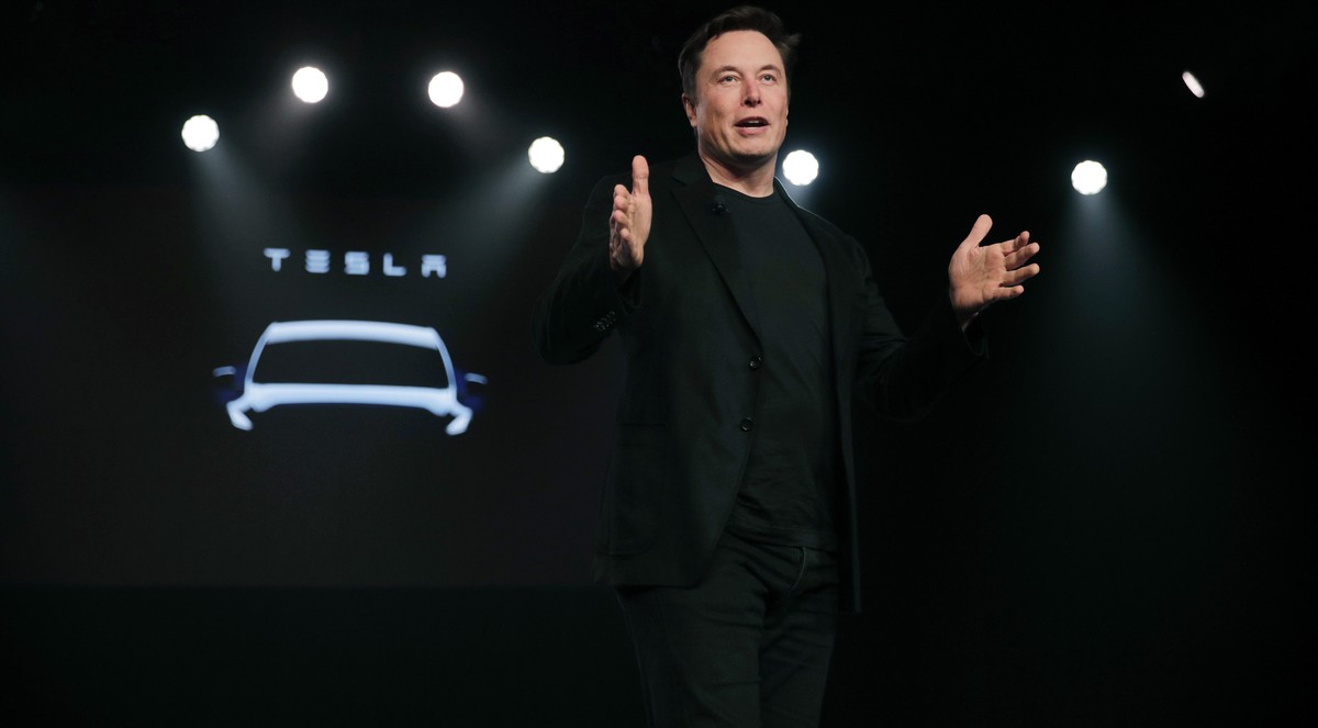 FILE- In this March 14, 2019, file photo Tesla CEO Elon Musk speaks before unveiling the Model Y at Tesla's design studio in Hawthorne, Calif. Shares of electric vehicle maker Tesla Inc. fell at  ...