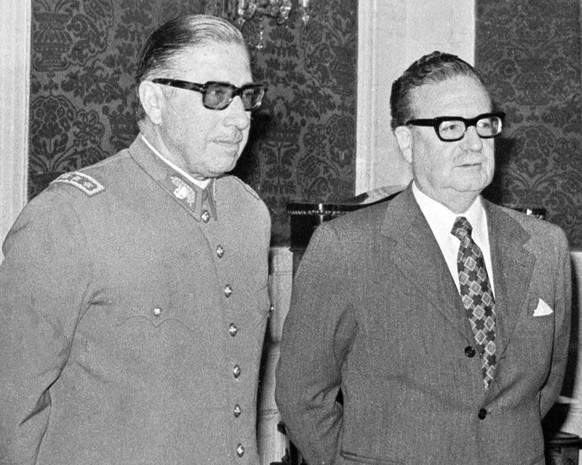 FILE - In this Aug. 23, 1973 file photo, Chilean Gen. Augusto Pinochet, left, and President Salvador Allende, attend a ceremony naming Pinochet as commander in chief of the Army. Chile marks the 45th  ...