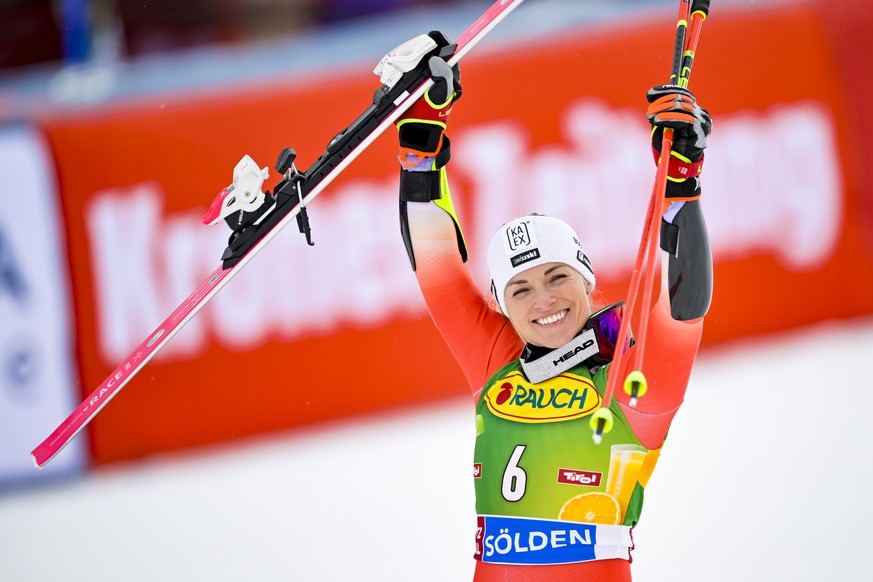 Third placed Lara Gut-Behrami from Switzerland celebrates in the finish are during the second run of the Womens Giant Slalom race of the FIS Alpine Ski World Cup season opener on the Rettenbach glaci ...
