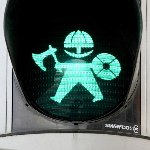 Pedestrian green traffic light with a viking in Aarhus, Denmark, Aarhus, Denmark - August 6, 2020: Pedestrian green traffic light with a viking in Aarhus, Denmark