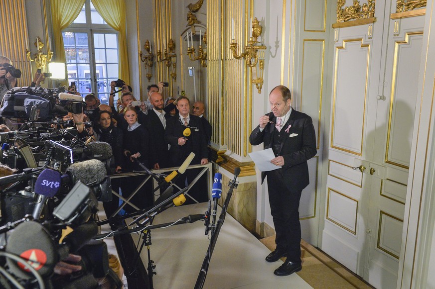 Permanent secretary of the Swedish Academy, Peter Englund faces the media as he prepares to announce French writer Patrick Modiano as the winner of the 2014 Nobel Prize in Literature, Thursday Oct. 9, ...