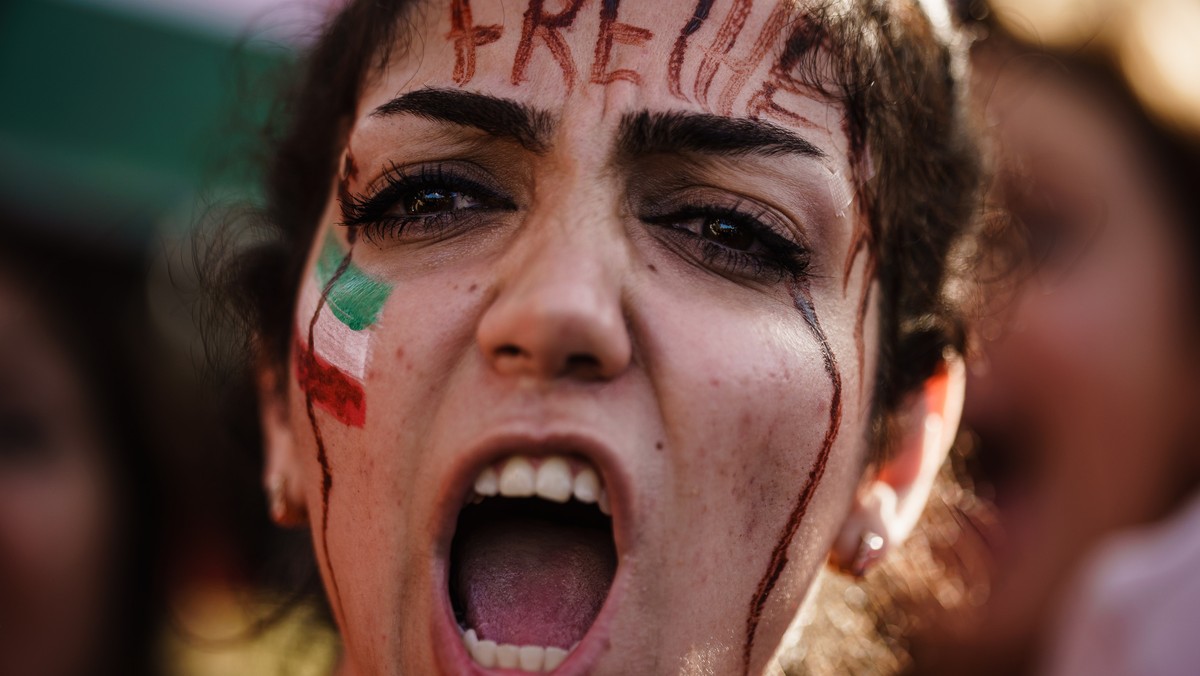 epa10259150 A demonstrator with the word 'freedom' in German inscribed on her forehead shouts during a rally in solidarity with Iranian protests following the death of Mahsa Amini, in Berlin ...