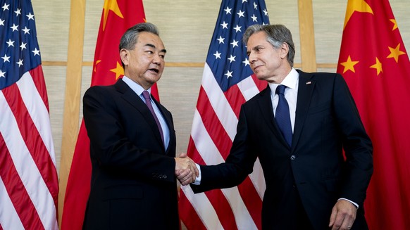 US Secretary of State Antony Blinken, right, shakes hands with Chinese Foreign Minister Wang Yi at a meeting in Nusa Dua on the Indonesian holiday island of Bali on Saturday, July 9, 2022. (Ste…