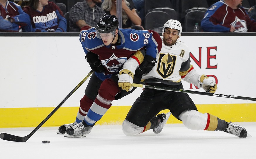 Colorado Avalanche right wing Mikko Rantanen, left, skates around Vegas Golden Knights left wing Pierre-Edouard Bellemare during the third period of an NHL hockey game Friday, Oct. 27, 2017, in Las Ve ...