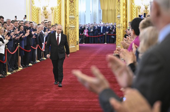Vladimir Putin walks during an inauguration ceremony as Russian President in the Grand Kremlin Palace in Moscow, Russia, Tuesday, May 7, 2024. Putin began his fifth term Tuesday as Russian leader at a ...
