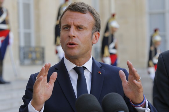 French President Emmanuel Macron gestures as he speaks to the media after a meeting United Nations and European officials with at the Elysee Palace in Paris, France, Monday, July 22, 2019. European mi ...