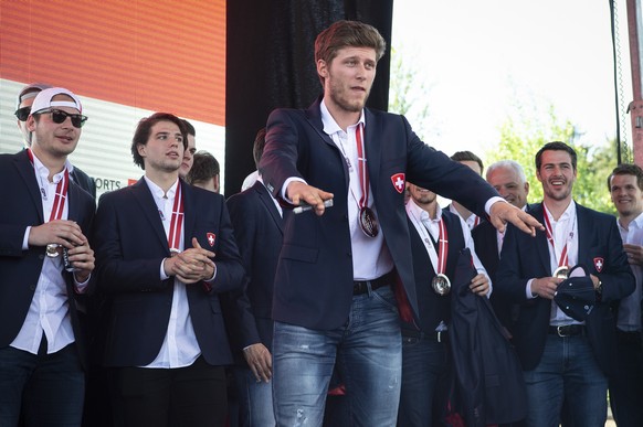 Switzerland’s ice hockey team with Enzo Corvi arrives and is welcomed by fans at Zurich airport in Kloten, Switzerland, Monday, May 21, 2018. Switzerland won the silver medal at the IIHF World Champio ...