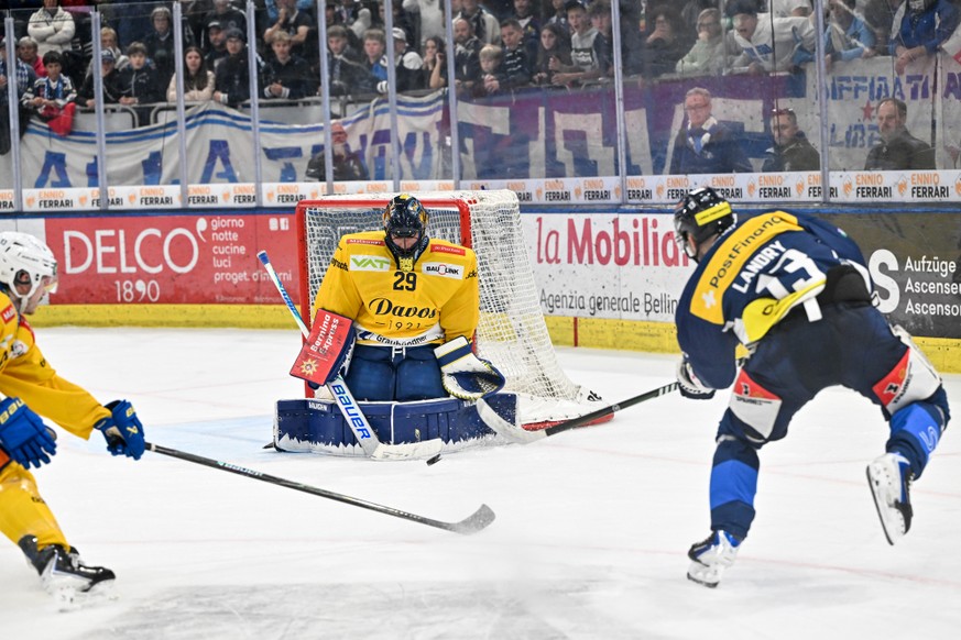 Goalie Sandro Aeschlimann (HCD) makes a save on Manix Landry (HCAP), during the regular season National League game between HC Ambri Piotta and HC Davos Piotta at the ice stadium Gottardo Arena, Switz ...