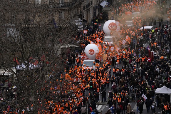 Protesters march during a demonstration, Tuesday, March 7, 2023 in Paris. Demonstrators were marching across France on Tuesday in a new round of protests and strikes against the government&#039;s plan ...