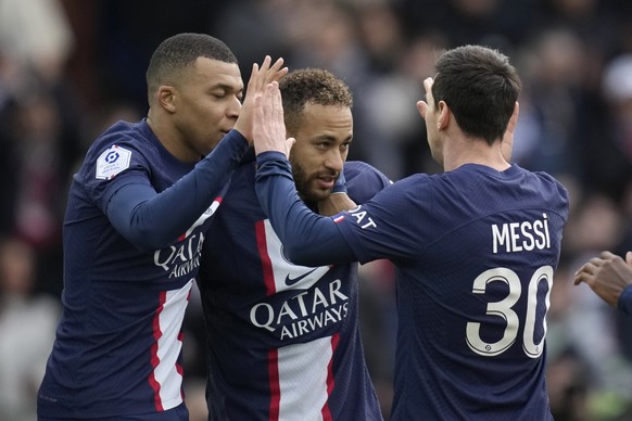 PSG&#039;s Neymar, centre, celebrates with his teammates Kylian Mbappe, left, and Lionel Messi after scoring his side&#039;s second goal during the French League One soccer match between Paris Saint-G ...