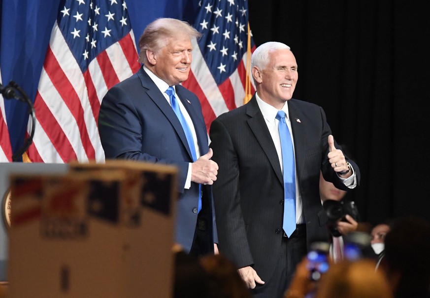 epa08623135 US President Donald J. Trump (L) and Vice President Mike Pence (R) greet the Republican National Convention at the Charlotte Convention Center in Charlotte, North Carolina, USA, 24 August  ...