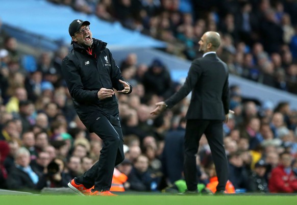 epaselect epa05858618 epa05858614 Manchester City&#039;s manager Pep Guardiola (R) and Liverpool&#039;s manager Juergen Klopp react during the English Premier League soccer match between Manchester Ci ...