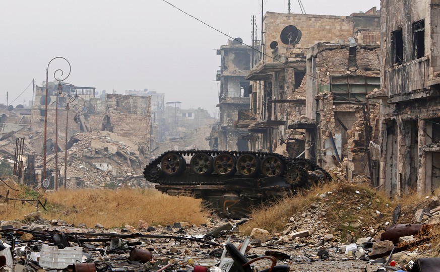 A damaged tank is pictured amid the damage near Umayyad mosque, in the government-controlled area of Aleppo, during a media tour, Syria December 13, 2016. REUTERS/Omar Sanadiki