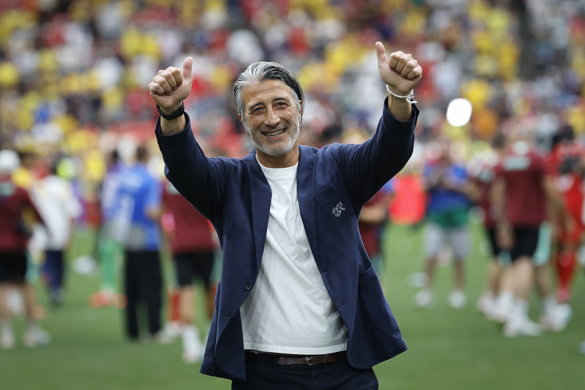 Switzerland's head coach Murat Yakin celebrates the victory after the World Cup round of 16 soccer match between Switzerland and Colombia at the BC Place stadium in Vancouver, Canada, Tuesday, Ju ...