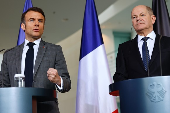 epa11222572 French President Emmanuel Macron (L) and German Chancellor Olaf Scholz attend a news conference at the Chancellery in Berlin, Germany, 15 March 2024. The leaders of the &#039;Weimar Triang ...