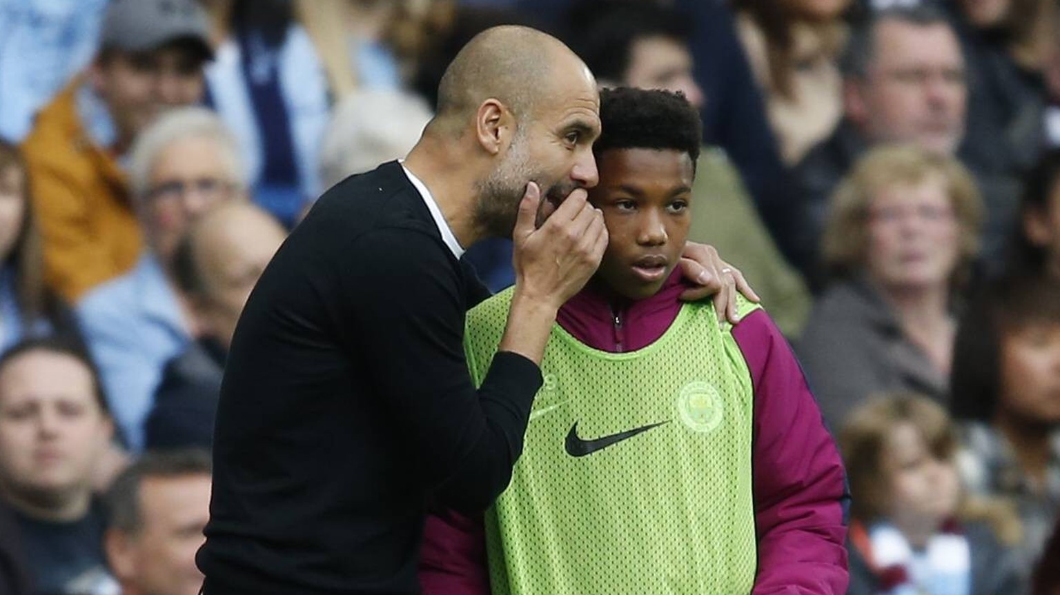 Josep Guardiola manager of Manchester City gives instructions to a ball boy during the premier league match at the Etihad Stadium, Manchester. Picture date 22nd September 2017. Picture credit should r ...