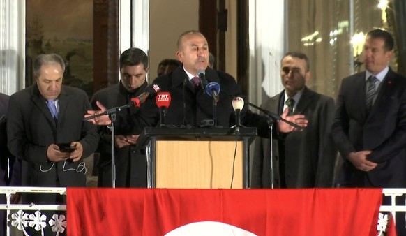 A still image taken from video footage shows Turkish Foreign Minister Mevlut Cavusoglu (C) addressing rally in Hamburg, Germany March 7, 2017, as part of a campaign trip for Turkey&#039;s upcoming con ...