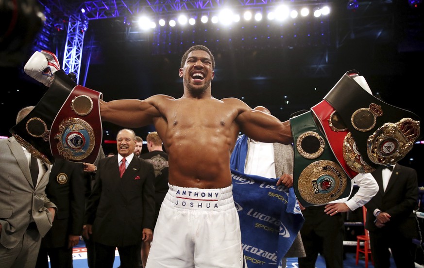 Anthony Joshua celebrates defeating Alexander Povetkin to retained his WBA, IBF, and WBO heavyweight boxing titles, Saturday, Sept. 22, 2018, at Wembley Stadium in London. (Nick Potts/PA via AP)