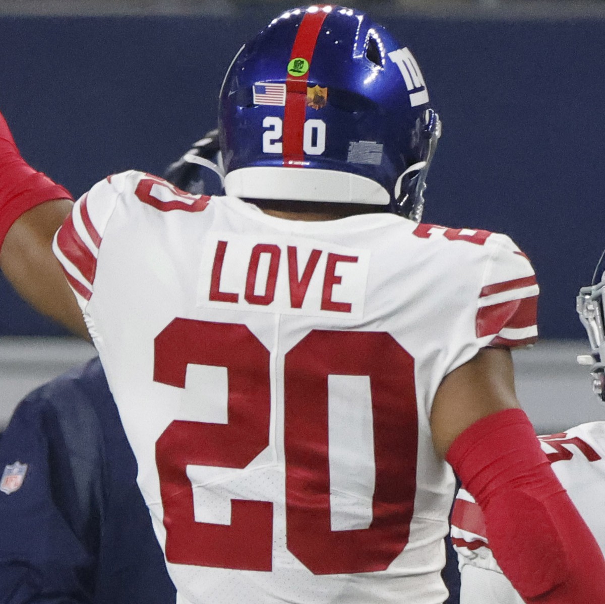 New York Giants cornerback Rodarius Williams, right, celebrates with Julian Love (20) after intercepting a pass against the Dallas Cowboys during the first half of an NFL football game Thursday, Nov.  ...