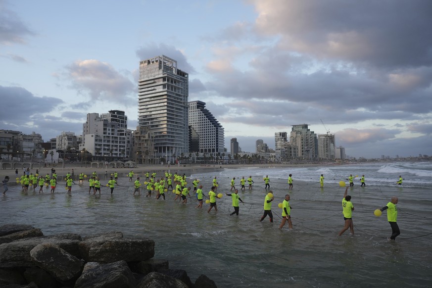 Relatives and supporters of Israelis held hostage by Hamas in Gaza release balloons to mark the 600 days of captivity, demanding their release and ending of the war in Tel Aviv, Israel, Wednesday, May ...