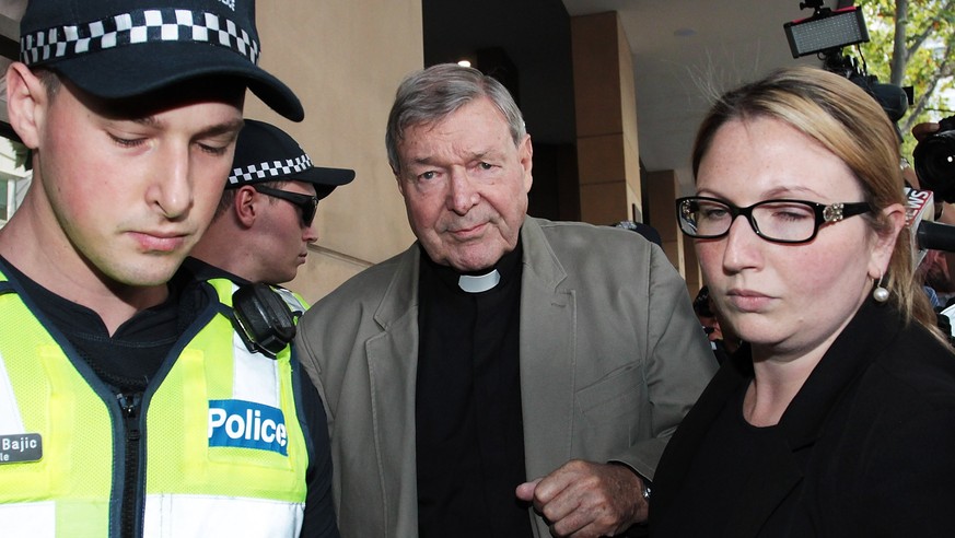 epa06581623 Cardinal George Pell (C) leaves the Melbourne Magistrates Court in Melbourne, Australia, 05 March 2018. Australia&#039;s most senior Catholic leader, Cardinal George Pell appeared at court ...