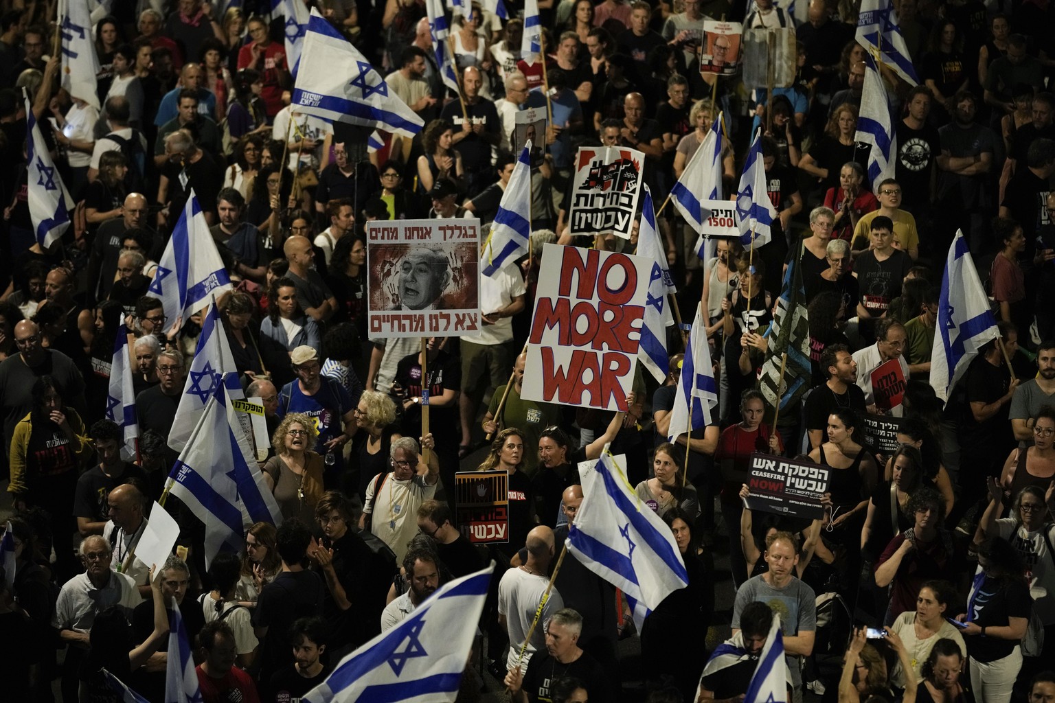 FILE - People protest against Israeli Prime Minister Benjamin Netanyahu&#039;s government and call for the release of hostages held in the Gaza Strip by the Hamas militant group, in Tel Aviv, Israel,  ...