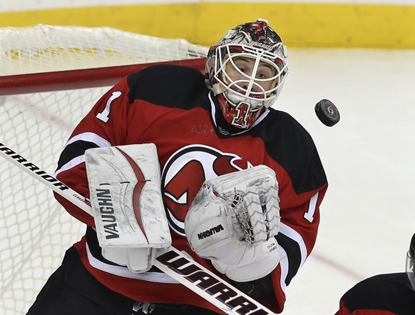 New Jersey Devils goalie Keith Kinkaid (1) blocks a shot on goal during the third period of an NHL hockey game against the Los Angeles Kings Sunday, Feb. 14, 2016, in Newark N.J. Kinkaid had his first ...