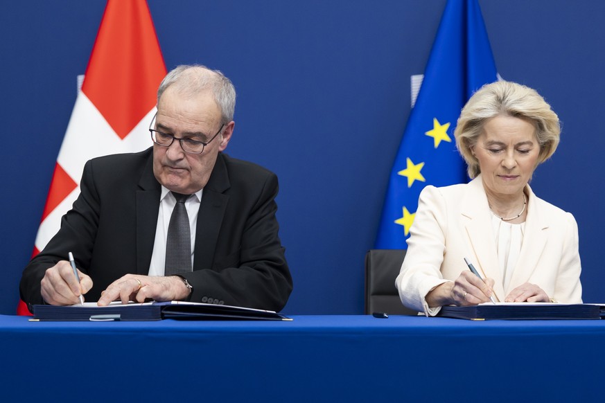 KEYPIX - Swiss Federal President Guy Parmelin, left, and European Commission President Ursula von der Leyen sign a package of bilateral agreements between the European Union and Switzerland, in Brusse ...