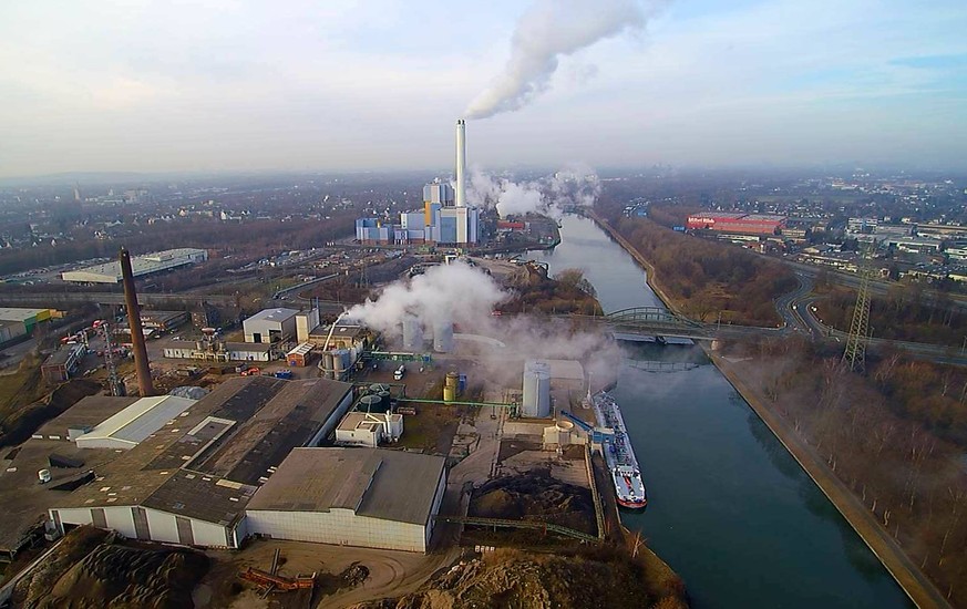 epa05796341 A drone picture shows steam rising from chemical tanks (C) on a factory site in Oberhausen, Germany, 16 January 2017. Gases escaped from the site after an accident, leading the Oberhausen  ...