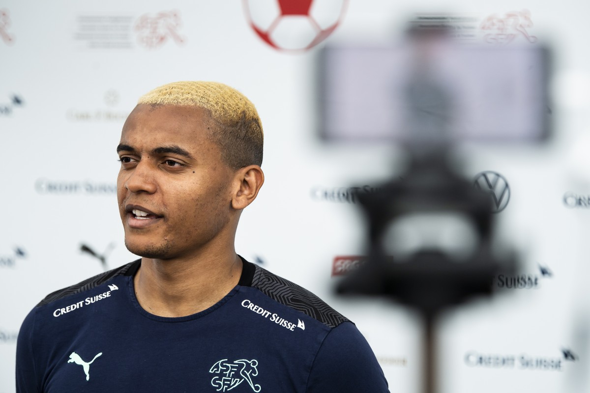 epa09282304 Switzerland's defender Manuel Akanji speaks to journalists during the UEAF Euro 2020 soccer tournament at the Tre Fontane sports centre, in Rome, Italy, 18 June 2021. EPA/JEAN-CHRISTO ...