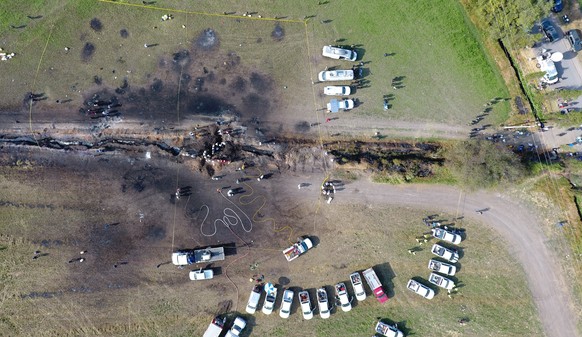 The ground is scorched where an oil pipeline exploded in Tlahuelilpan, Hidalgo state, Mexico, Saturday, Jan. 19, 2019. A massive fireball that engulfed people scooping up fuel spilling from a pipeline ...