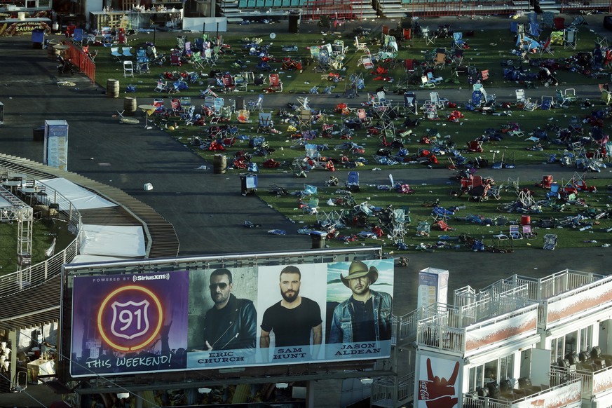 FILE - In this Tuesday, Oct. 3, 2017, file photo, personal belongings and debris litters the Route 91 Harvest festival grounds across the street from the Mandalay Bay resort and casino in Las Vegas. O ...