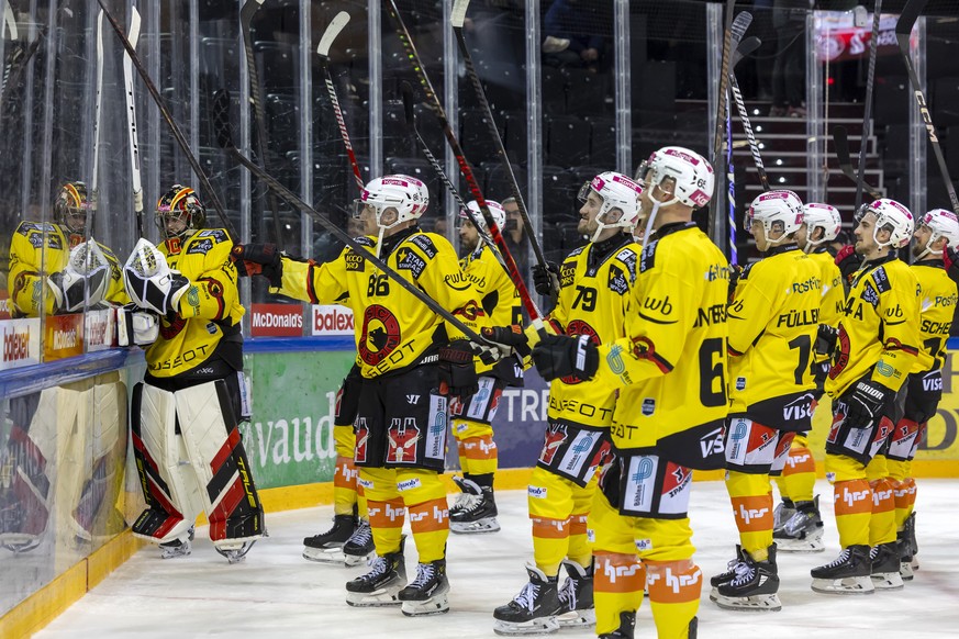 Bern&#039;s players celebrate their victory after defeating the team Geneve-Servette, during a National League regular season game of the Swiss Championship between Geneve-Servette HC, GSHC, and SC Be ...