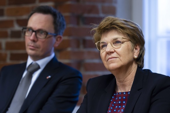 Swiss Federal President Viola Amherd, right, listens to a presentation of Lieutenant Colonel Bernard G. Hoffmann, Deputy Director and Chief of Staff NATO CCDCoE (not pictured), beside Martin Michelet, ...