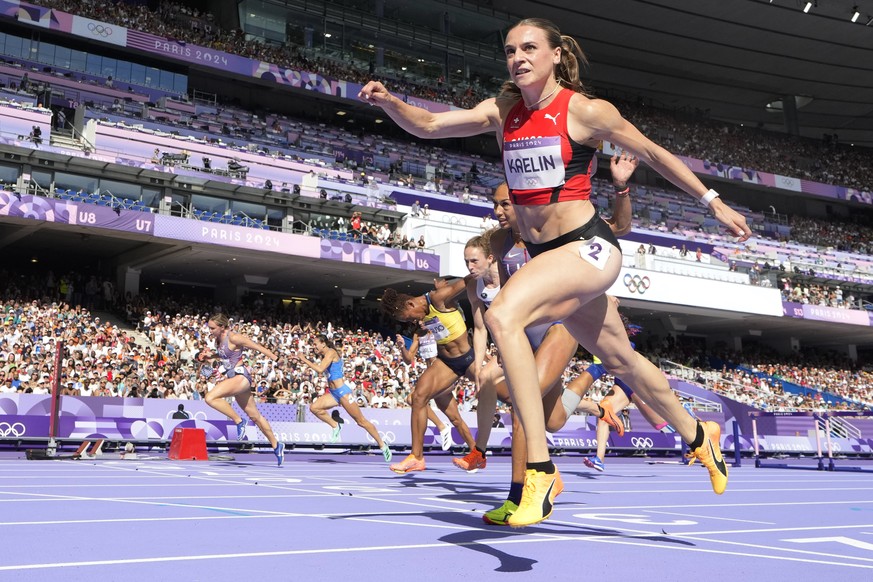 Annik Kaelin, of Switzerland, wins her heat in the women&#039;s heptathlon 100-meter hurdles at the 2024 Summer Olympics, Thursday, Aug. 8, 2024, in Saint-Denis, France. (AP Photo/David J. Phillip)