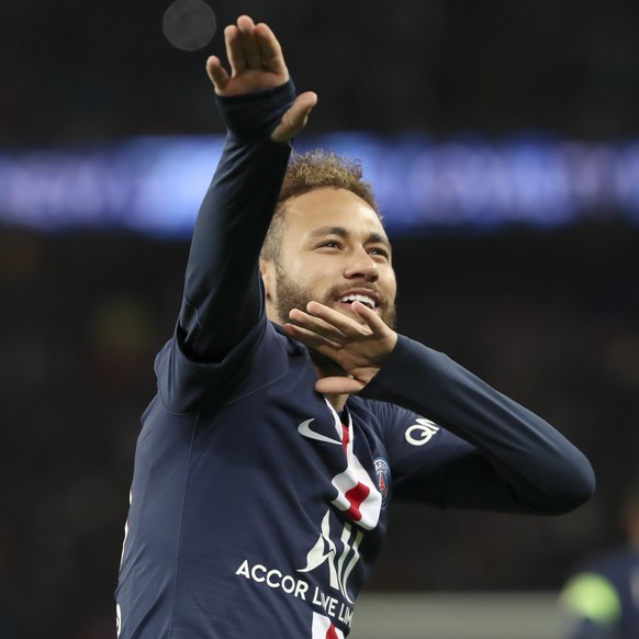 PSG's Neymar celebrates after scoring his side's second goal during the League One soccer match between Paris Saint Germain and Amiens, at the Parc des Princes stadium in Paris, Saturday, De ...